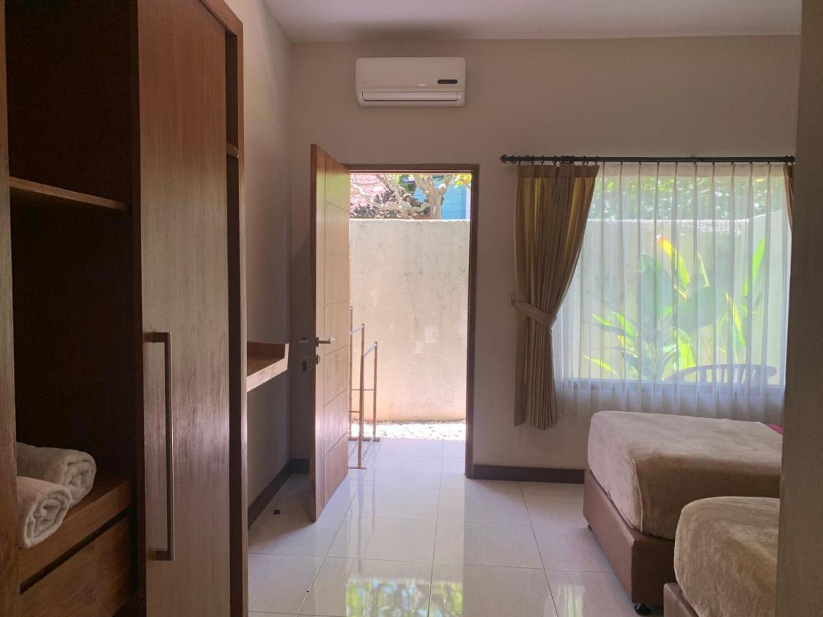 Kuta Suci Guesthouse エクステリア 写真